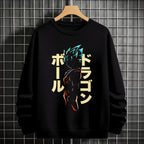 Black crewneck sweatshirt featuring Goku shadow silhouette with blue and pink neon aura and vertical Japanese text, flat lay on grey background.