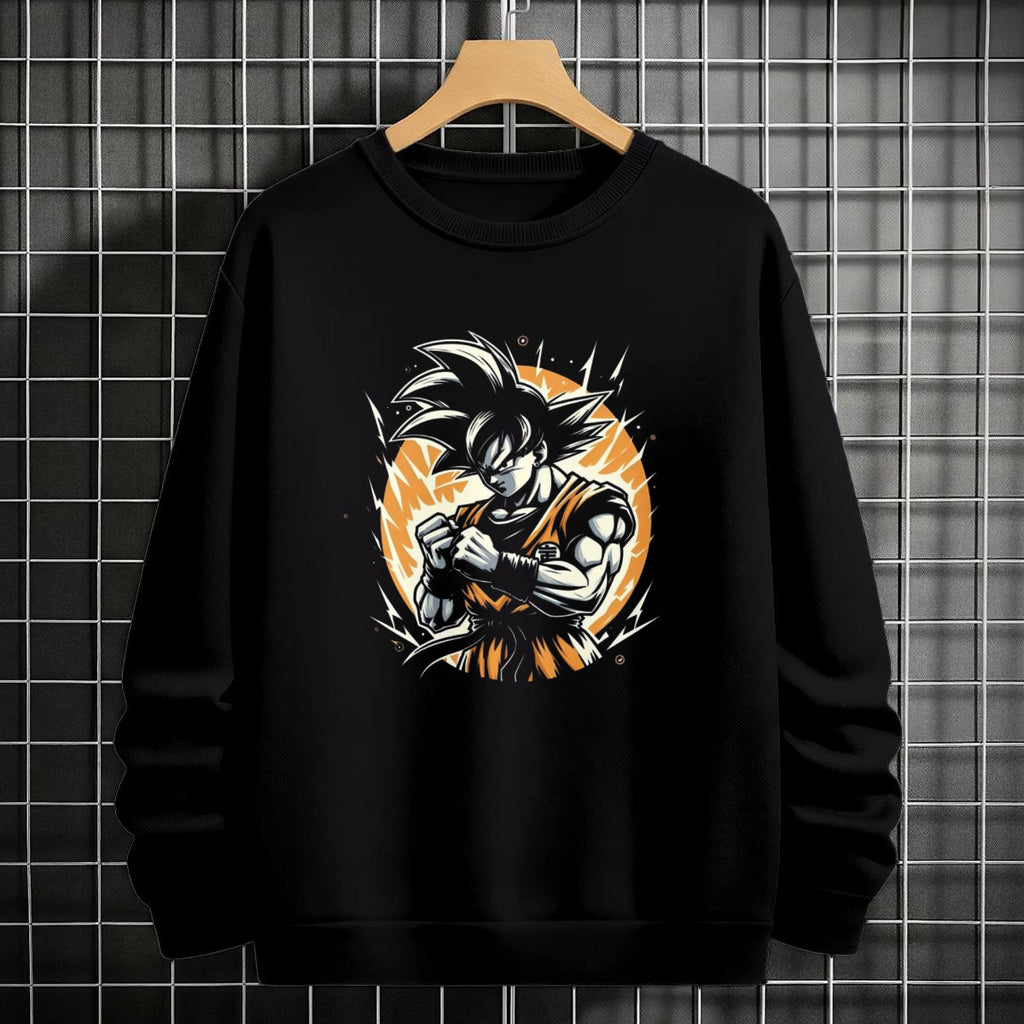 Black crewneck sweatshirt featuring Goku shadow silhouette with blue and pink neon aura and vertical Japanese text, flat lay on grey background.