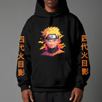 Black pullover hoodie featuring Naruto Uzumaki portrait on chest and vertical orange Japanese Kanji text on sleeves, worn by model on grey background.
