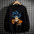 Black crewneck sweatshirt featuring Goku shadow silhouette with blue and pink neon aura and vertical Japanese text, flat lay on grey background.