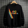Black sweatshirt with 'ARC Raiders' colorful design on a hanger against a tiled wall.