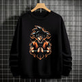 Black crewneck sweatshirt featuring Goku shadow silhouette with blue and pink neon aura and vertical Japanese text, flat lay on grey background.