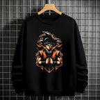 Black crewneck sweatshirt featuring Goku shadow silhouette with blue and pink neon aura and vertical Japanese text, flat lay on grey background.