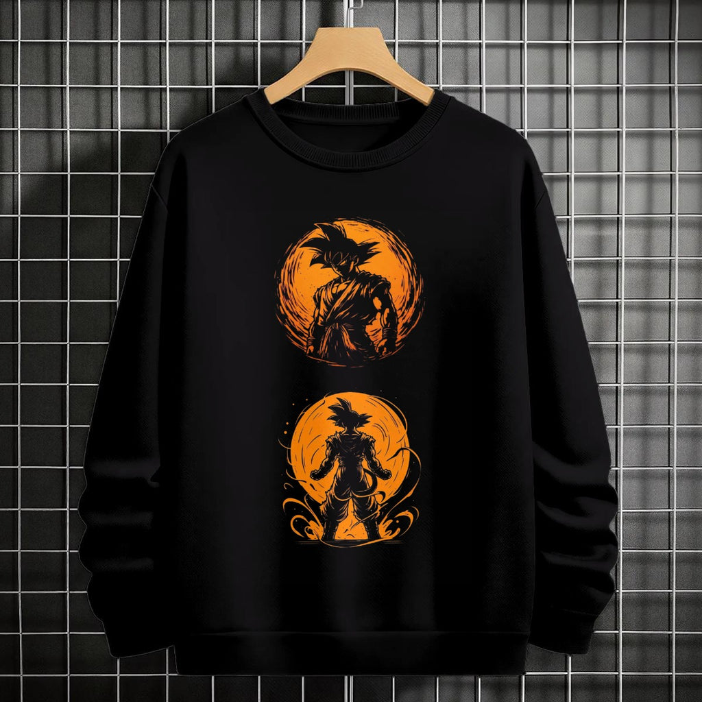 Black crewneck sweatshirt featuring Goku shadow silhouette with blue and pink neon aura and vertical Japanese text, flat lay on grey background.
