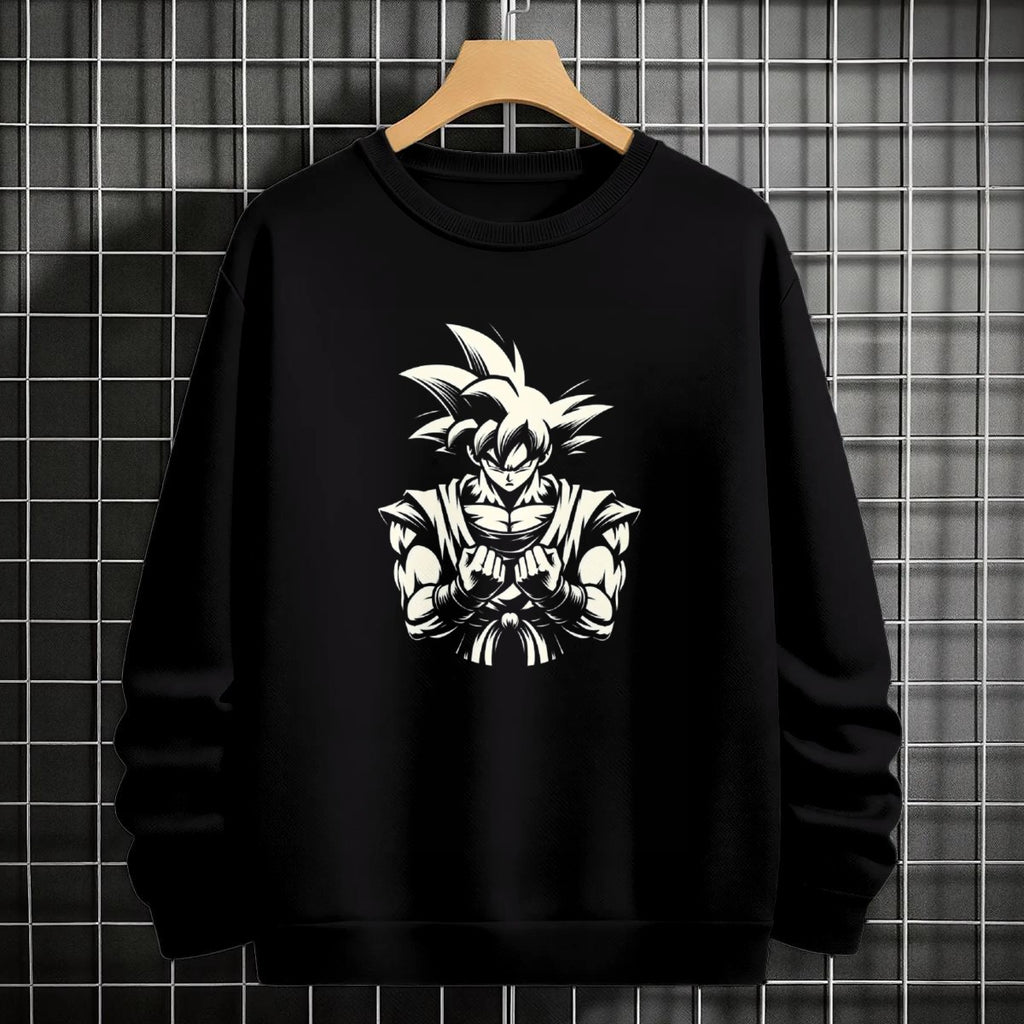 Black crewneck sweatshirt featuring Goku shadow silhouette with blue and pink neon aura and vertical Japanese text, flat lay on grey background.