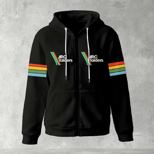Black zip-up hoodie featuring ARC Raiders logo on chest and retro red, yellow, green, and blue stripes on sleeves, flat lay on grey background.