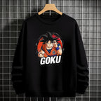 Black crewneck sweatshirt featuring Goku shadow silhouette with blue and pink neon aura and vertical Japanese text, flat lay on grey background.
