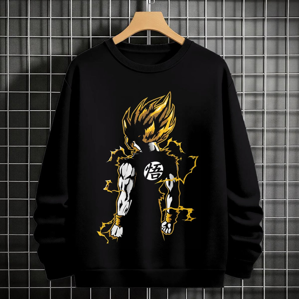 Black crewneck sweatshirt featuring Goku shadow silhouette with blue and pink neon aura and vertical Japanese text, flat lay on grey background.