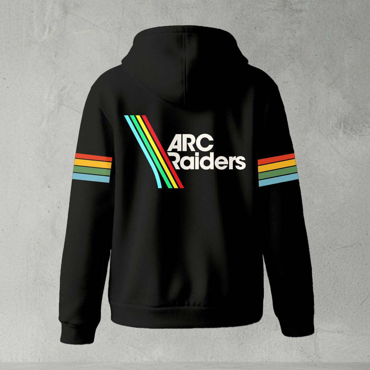 Black zip-up hoodie featuring ARC Raiders logo on chest and retro red, yellow, green, and blue stripes on sleeves, flat lay on grey background.