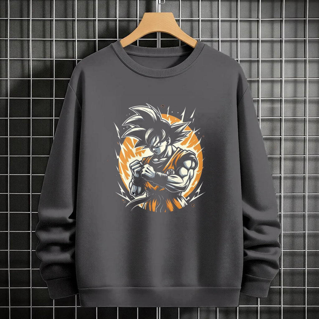Black crewneck sweatshirt featuring Goku shadow silhouette with blue and pink neon aura and vertical Japanese text, flat lay on grey background.
