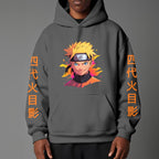 Black pullover hoodie featuring Naruto Uzumaki portrait on chest and vertical orange Japanese Kanji text on sleeves, worn by model on grey background.