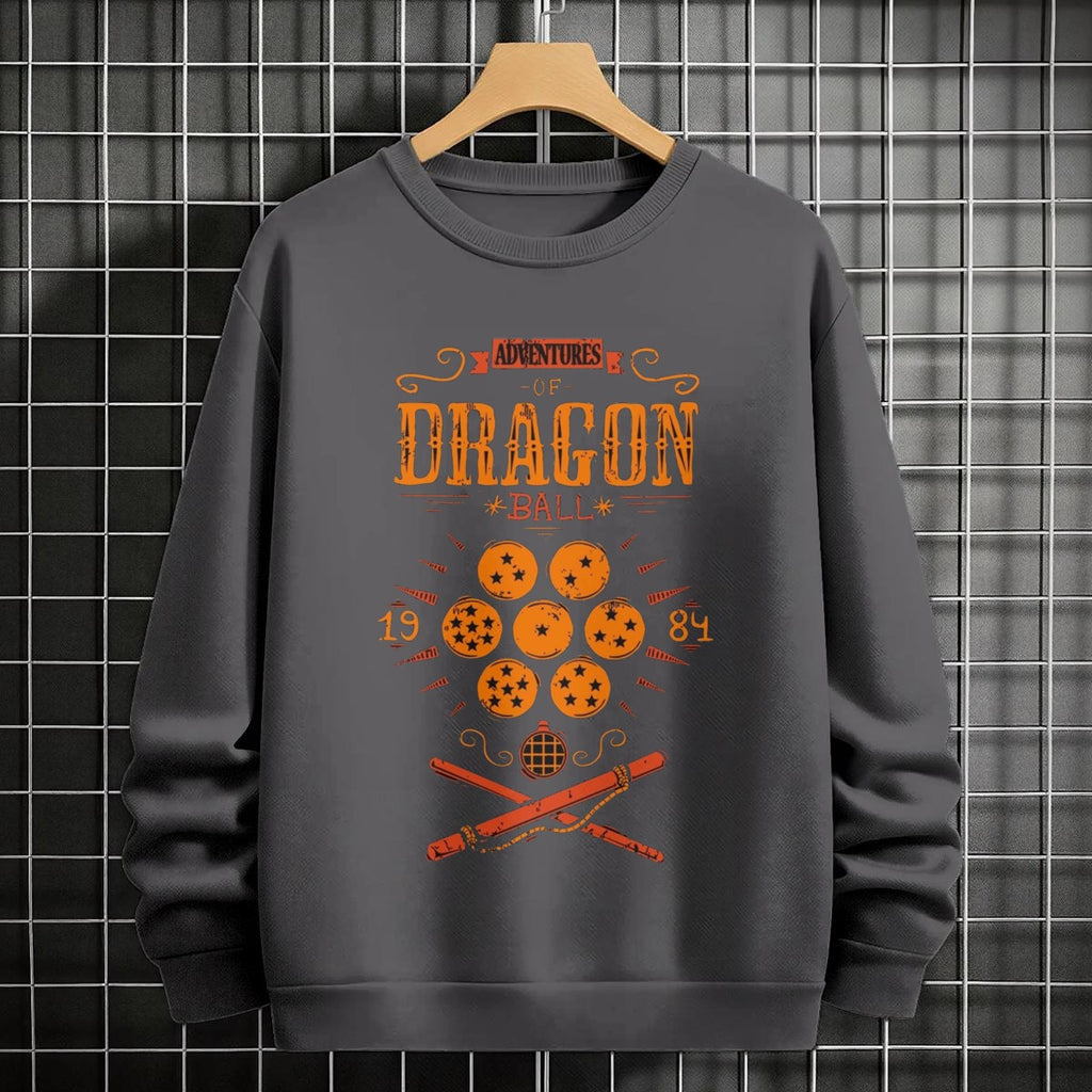 Black crewneck sweatshirt featuring Goku shadow silhouette with blue and pink neon aura and vertical Japanese text, flat lay on grey background.
