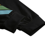 Close-up of a black fabric texture with geometric patterns on a white background