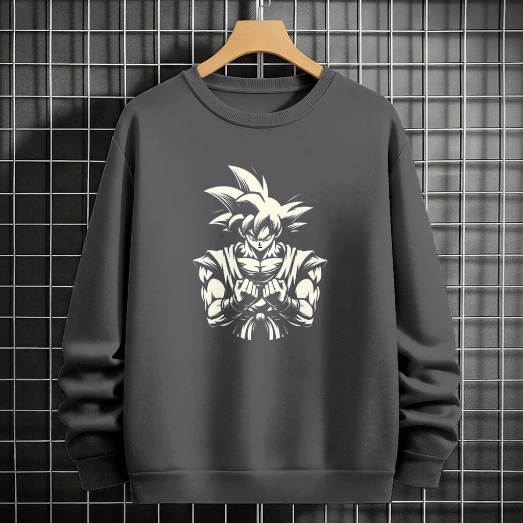 Black crewneck sweatshirt featuring Goku shadow silhouette with blue and pink neon aura and vertical Japanese text, flat lay on grey background.