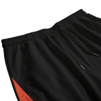 Black pants with a red section on a white background