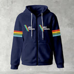 Black zip-up hoodie featuring ARC Raiders logo on chest and retro red, yellow, green, and blue stripes on sleeves, flat lay on grey background.