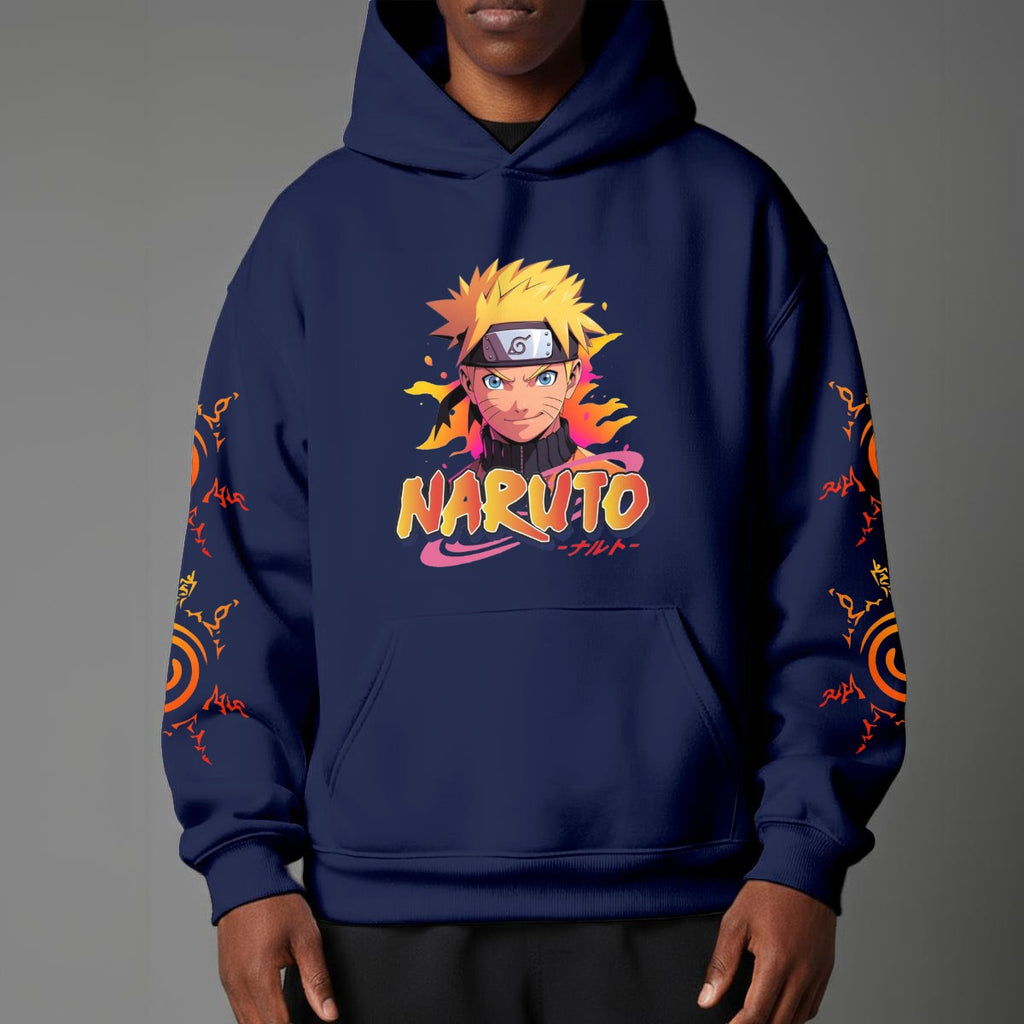 Black pullover hoodie featuring Naruto Uzumaki portrait on chest and vertical orange Japanese Kanji text on sleeves, worn by model on grey background.