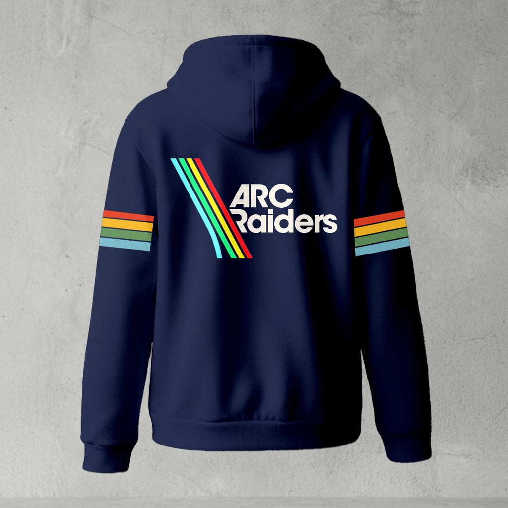 Black zip-up hoodie featuring ARC Raiders logo on chest and retro red, yellow, green, and blue stripes on sleeves, flat lay on grey background.