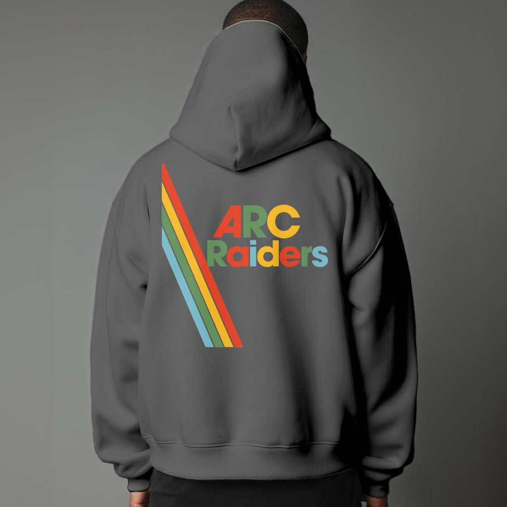 Person wearing a gray hoodie with 'ARC Raiders' colorful text design on the back against a gray background