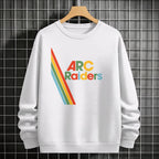 White sweatshirt with 'Arc Raiders' design on a hanger against a tiled wall.